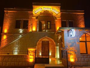 a building with a sign that reads naughty surprises house at Rustic Caves in Göreme