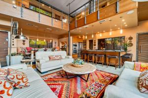 a living room with couches and a table at The Haven by Lodgewell - Where serenity meets sanctuary in Austin