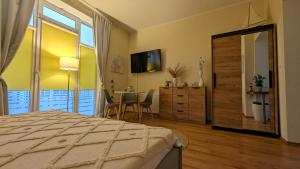 Telewizja i/lub zestaw kina domowego w obiekcie Studio Appartment Heinze
