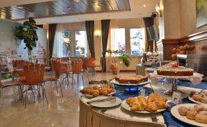 a bakery with many different types of pastries on display at Best Western Hotel I Colli in Macerata