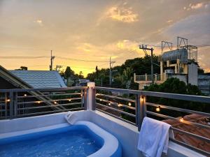 a hot tub on the balcony of a building at Mountain View in Binangonan