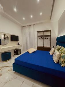 Letto o letti in una camera di Aries Suite Pompei