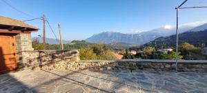 a stone wall with a view of mountains at Point of view 2 in Pramanta