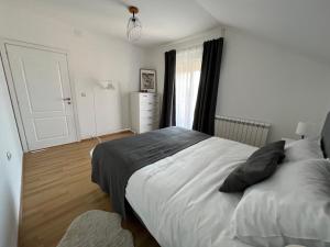 Postel nebo postele na pokoji v ubytování Apartman Magnolia