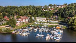 an aerial view of a marina with boats in the water at Grillkota Holzhütte in Lauenburg