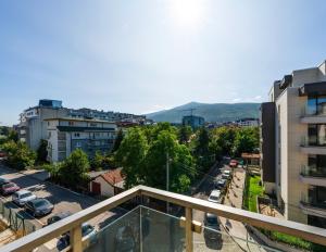 a view of a city from a balcony of a building at Vertigo Huge Apartment 2 Bedrooms Balcony Parking in Sofia