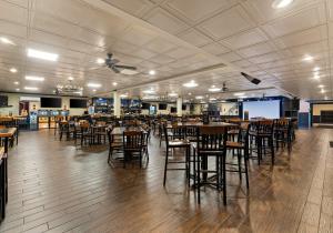 a dining room with tables and chairs in a restaurant at Red Roof Inn Reading in Reading