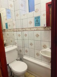 a bathroom with a toilet and a sink at Lovely private room in Central London next to Hampstead, Camden, and Golders Green in London