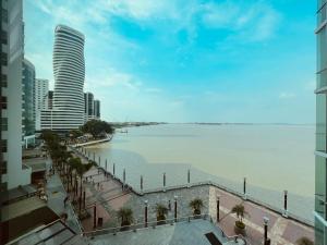 a view of a large body of water with a city at Suite frente al río en Puerto Santa Ana Riverfront in Guayaquil