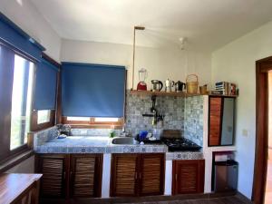 a kitchen with a sink and a counter top at MINI DEPARTAMENTO con vista al mar in San Agustinillo +10 photos