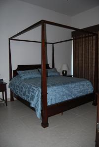 Postel nebo postele na pokoji v ubytování Casa Felsted Torre 1 304 Mayan Lakes resort + 16 fotografií