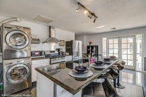 a kitchen with a table with dishes on it at *Msg for 5%off*1Bed1Bath HugeGuesthouse MidtownPHX in Phoenix