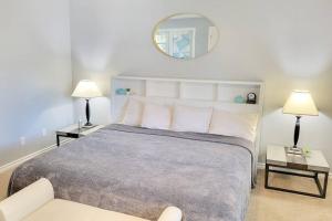 a bedroom with a large bed with two tables and a mirror at *Msg for 5%off*1Bed1Bath HugeGuesthouse MidtownPHX in Phoenix