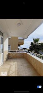 a balcony of a building with a view of the ocean at Murat Baris Residence in Alanya