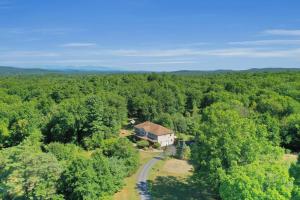 an aerial view of a house in the middle of a forest at Moondance Ridge Suites in New Paltz