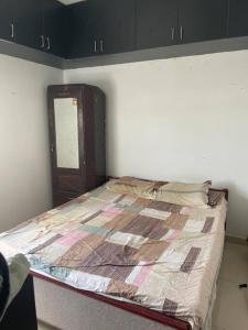 a bedroom with a bed in a room at Ranga Vila’s on ECR in Chennai