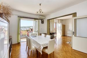 a dining room with a table and chairs at Apartments by the sea Pirovac, Sibenik - 11824 in Pirovac