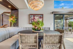 a dining room with a table and chairs at WAILEA ELUA, #1305^ condo in Wailea