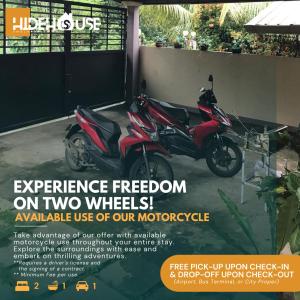 un anuncio para una motocicleta estacionada en un garaje en Pagadian City House Rental - Hidehouse en Pagadían​