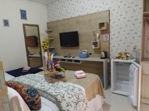 Et tv og/eller underholdning på Pousada Mulher Do Mar