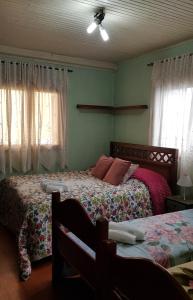 Ένα ή περισσότερα κρεβάτια σε δωμάτιο στο Charmoso apartamento da Vovó Enedina