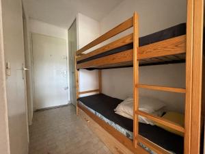 a room with two bunk beds and a hallway at Studio Sète, 1 pièce, 4 personnes - FR-1-338-434 in Sète