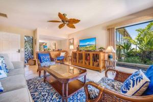 a living room with a couch and a table at WAILEA ELUA, #2201^ condo in Wailea