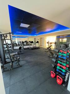 a gym with a lot of equipment in a room at Studio Nova Betãnia in Mossoró