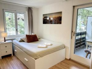 Postel nebo postele na pokoji v ubytování Central Zermatt Hideaway