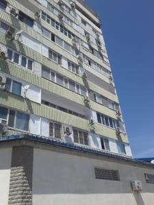 a building with a face on the side of it at квартира у моря in Aktau