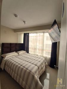 Ένα ή περισσότερα κρεβάτια σε δωμάτιο στο HATARY HOTEL BOUTIQUE