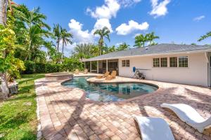 a swimming pool in the backyard of a house at Luxury Pool & Spa Home near Beaches & Downtown in Fort Myers