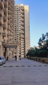 a large building with a car parked in front of it at Lite Stays in Mumbai