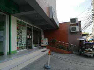 a building with a sign on the side of it at Meaco Royal Hotel - Biñan Laguna in Biñan