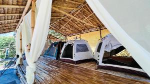 a group of tents parked in a room at Green smile camping and private beach in Krabi town