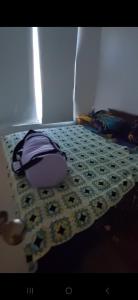 En eller flere senger på et rom på Departamento Las Cruces Frente al Mar