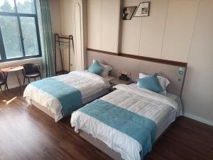 Letto o letti in una camera di Meizhou Cloudy B&B