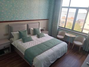 Letto o letti in una camera di Meizhou Cloudy B&B