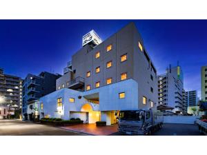 a truck is parked in front of a building at Kawasaki Hotel Park - Vacation STAY 02891v in Kawasaki