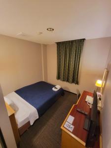 Un pat sau paturi într-o cameră la Hotel Seagull