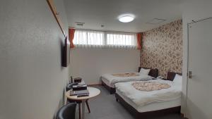 Katil atau katil-katil dalam bilik di Esperanza Resort Atami-エスペランサリゾート熱海
