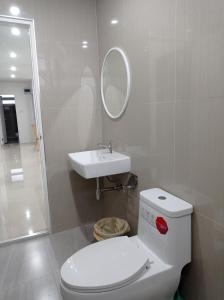 a bathroom with a toilet and a sink at Sealife4 Beach Pool Villa in Rayong