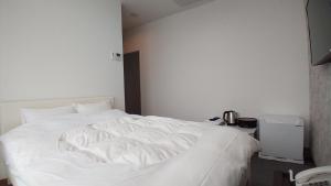 Katil atau katil-katil dalam bilik di Esperanza Resort Atami-エスペランサリゾート熱海