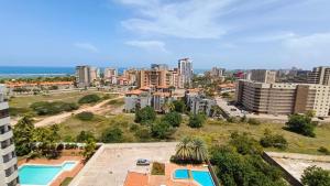 an aerial view of a city with buildings at RES. CORAL in Porlamar