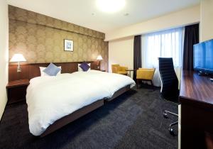 Posteľ alebo postele v izbe v ubytovaní Daiwa Roynet Hotel Kobe Sannomiya