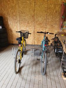 two bikes parked next to each other in a room at Pokoje Pod 22 Bis in Łebcz
