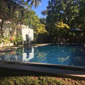 a swimming pool in the backyard of a house at The Residence Bentota in Bentota