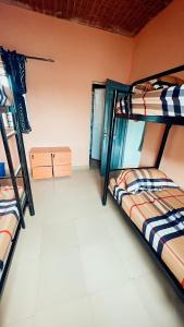 a room with two bunk beds in a dorm at A Home Away From Home in Mawere