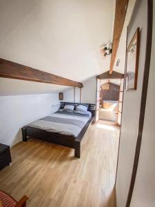 a bedroom with a bed in a room at Ryokan Lankana in Exideuil +6 photos