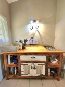 a kitchen with a wooden counter with a sink at Seaview Villa 26 in Margate